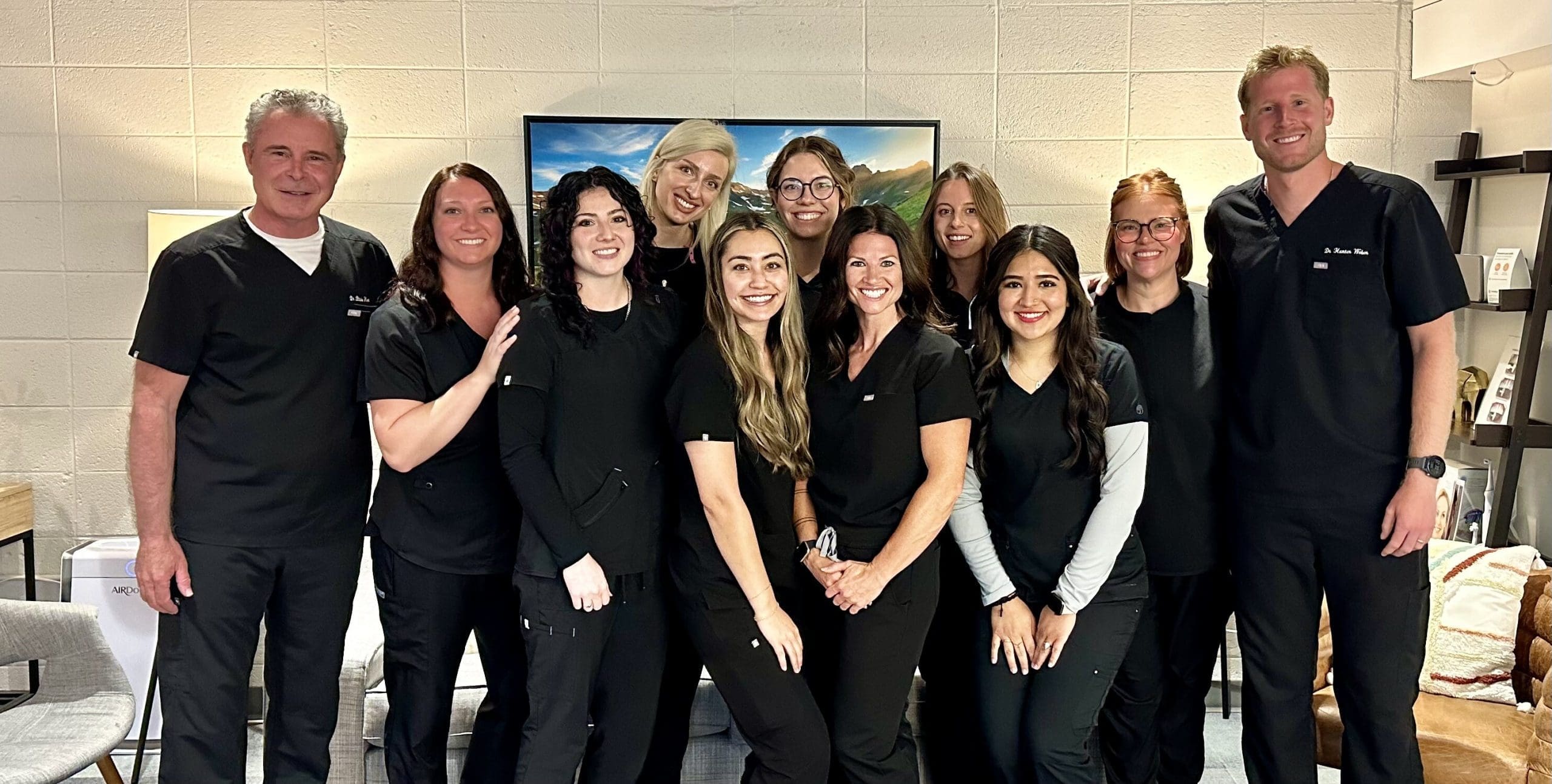 The full team at Dental Solutions of Central Park, Aurora CO, including hygienists, dental assistants, and front desk staff